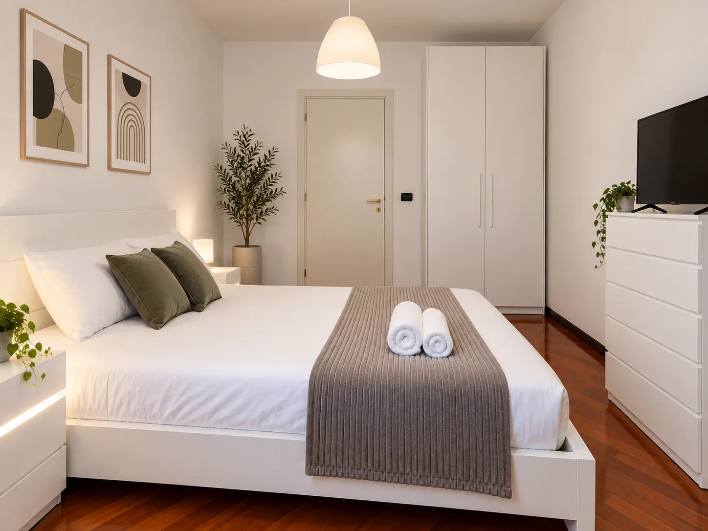 The Urban Ravanas bright bedroom with wardrobe and television